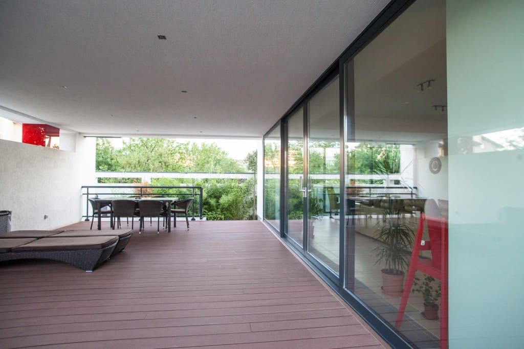 Sliding doors bring enclosed outdoor space into this modern home