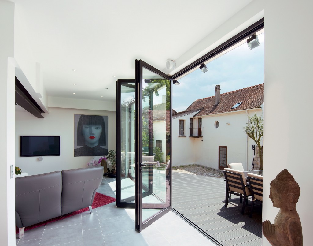 Sliding-folding-doors-bring-home-and-garden-together-in-this-French-country-home