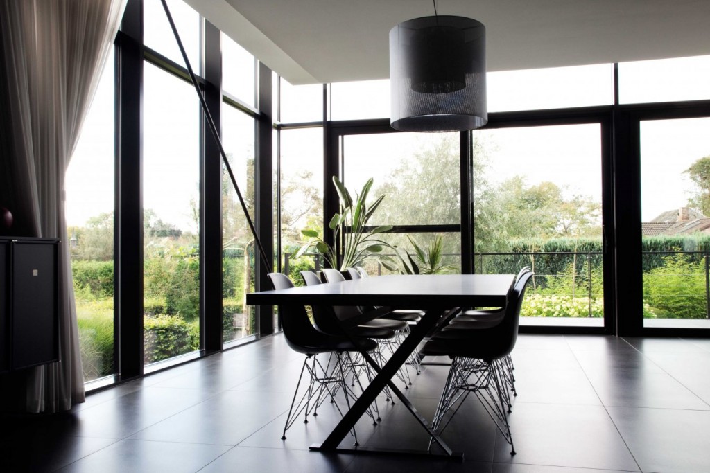 Windows and doors make this chic, contemporary Belgian home