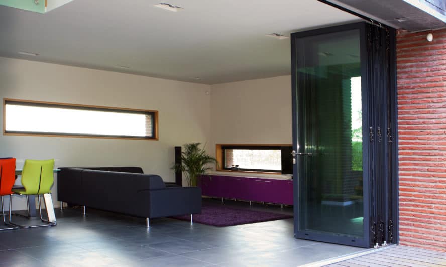 Extending into the loft? Why not maximise your light and views with sliding folding doors?